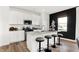 Beautiful kitchen with white cabinets, stainless steel appliances, and a large center island with seating at 4405 Mendocino Blvd, Indianapolis, IN 46239