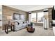 Inviting living room with a wood accent wall, comfortable sofa, and view of the outdoors at 4405 Mendocino Blvd, Indianapolis, IN 46239