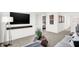 Modern living room with a flat screen television and a view into a bedroom at 4405 Mendocino Blvd, Indianapolis, IN 46239