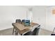 Modern office with a dark wooden desk, comfortable chairs, and ample lighting at 4405 Mendocino Blvd, Indianapolis, IN 46239