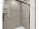 Modern glass shower with gray tiled walls and sleek fixtures, offering a spa-like experience at 4405 Mendocino Blvd, Indianapolis, IN 46239