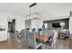 Open-concept dining area featuring a rustic wood table with seating for eight, perfect for gatherings at 4411 Mendocino Blvd, Indianapolis, IN 46239