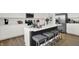 Stylish kitchen with a central island, stainless steel appliances, and sleek gray stools at 4411 Mendocino Blvd, Indianapolis, IN 46239