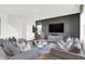 Inviting living room featuring a plush sofa, glass coffee table, and contemporary decor with a sleek entertainment center at 4411 Mendocino Blvd, Indianapolis, IN 46239