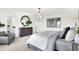 Airy main bedroom boasts a large dresser, decorative lighting, and contemporary art at 4411 Mendocino Blvd, Indianapolis, IN 46239