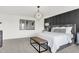 Spacious main bedroom with a padded headboard, contemporary lighting, and natural light at 4411 Mendocino Blvd, Indianapolis, IN 46239