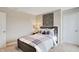 Spacious bedroom featuring wood-look accents, cozy carpet, and comfortable furnishings at 4518 Laughter Ln, Indianapolis, IN 46235