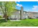 Well-maintained backyard with a patio set, mature trees, and a lush green lawn at 4602 Amesbury Pl, Westfield, IN 46062