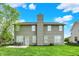 Spacious backyard with lush green grass, patio area, and mature trees at 4602 Amesbury Pl, Westfield, IN 46062