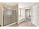 This bathroom features a shower, soaking tub, and tile flooring at 4602 Amesbury Pl, Westfield, IN 46062