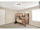 This bedroom has carpet floors, a window, and bunkbeds at 4602 Amesbury Pl, Westfield, IN 46062