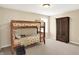 This bedroom has carpet floors, a window, and bunkbeds at 4602 Amesbury Pl, Westfield, IN 46062