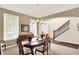Inviting dining room with natural light, a classic chandelier, and easy access to the staircase and entryway at 4602 Amesbury Pl, Westfield, IN 46062