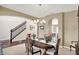 Elegant dining room featuring classic furnishings, a decorative chandelier, and a view of the staircase at 4602 Amesbury Pl, Westfield, IN 46062