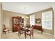 Bright dining room with large windows, a chandelier, and elegant furniture for comfortable entertaining at 4602 Amesbury Pl, Westfield, IN 46062
