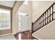 Bright and airy foyer with staircase, hardwood floors, and natural light at 4602 Amesbury Pl, Westfield, IN 46062