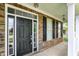 Welcoming front porch with brick accents, black shutters, and a stylish entrance door at 4602 Amesbury Pl, Westfield, IN 46062