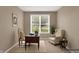 Cozy home office setup with a traditional desk, comfortable chairs, and ample natural light at 4602 Amesbury Pl, Westfield, IN 46062