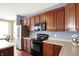 Well-equipped kitchen featuring stainless steel appliances and plenty of counter space at 4602 Amesbury Pl, Westfield, IN 46062