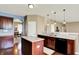 A contemporary kitchen boasts sleek countertops, abundant lighting, and stylish appliances for a modern living at 4602 Amesbury Pl, Westfield, IN 46062