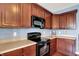 A closer view of the kitchen cabinets and appliances, designed for cooking with efficiency and style at 4602 Amesbury Pl, Westfield, IN 46062