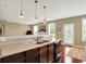 A spacious kitchen featuring sleek countertop and backsplash, complete with lighting and modern appliances at 4602 Amesbury Pl, Westfield, IN 46062