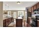 The kitchen features updated appliances, an island, and a seamless transition into the adjacent dining area at 4602 Amesbury Pl, Westfield, IN 46062