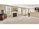 Spacious living room with fireplace, large windows, and open floor plan at 4602 Amesbury Pl, Westfield, IN 46062