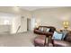 Spacious living room with neutral carpet, vaulted ceiling and leather seating at 4602 Amesbury Pl, Westfield, IN 46062