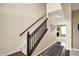 Beautiful staircase with wooden railing and carpeted steps leading to the upper level at 4602 Amesbury Pl, Westfield, IN 46062