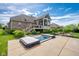 Spacious backyard featuring a hot tub, lush landscaping, and a screened-in porch, perfect for relaxation and outdoor enjoyment at 4890 Benthaven E Dr, Bargersville, IN 46106