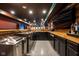 Finished basement bar area with custom wood accents, and stylish lighting at 4890 Benthaven E Dr, Bargersville, IN 46106