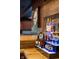 Custom basement bar displaying liquor bottles, glasses and bar accessories at 4890 Benthaven E Dr, Bargersville, IN 46106