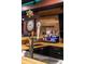 Basement bar with wood countertop, beer taps, custom lighting, and a stylish decor at 4890 Benthaven E Dr, Bargersville, IN 46106