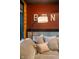 A close up of a comfy sectional sofa with decorative pillows in the finished basement at 4890 Benthaven E Dr, Bargersville, IN 46106