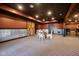 Finished basement featuring a rustic barn door, wet bar, and cozy seating area at 4890 Benthaven E Dr, Bargersville, IN 46106