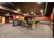 Large finished basement with custom bar, ample seating, and stylish decor at 4890 Benthaven E Dr, Bargersville, IN 46106