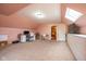 Upstairs bedroom featuring a skylight, neutral carpet, and potential for use as an office at 4890 Benthaven E Dr, Bargersville, IN 46106