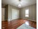 An ample bedroom with hardwood floors, a large double closet, and bright window at 4890 Benthaven E Dr, Bargersville, IN 46106