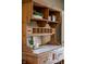 Antique hutch detail with shelving and decorative features at 4890 Benthaven E Dr, Bargersville, IN 46106