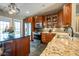Kitchen area with a large island, granite countertops, and stainless steel appliances at 4890 Benthaven E Dr, Bargersville, IN 46106