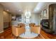 Living room featuring hardwood floors, a fireplace, and comfortable seating at 4890 Benthaven E Dr, Bargersville, IN 46106