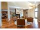 Open concept living room with hardwood flooring, fireplace, comfortable seating and natural light at 4890 Benthaven E Dr, Bargersville, IN 46106