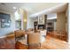 Spacious living room featuring hardwood floors, a fireplace, and comfortable seating arrangement at 4890 Benthaven E Dr, Bargersville, IN 46106