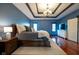 Tastefully decorated bedroom featuring hardwood floors, dresser, and a luxurious bed at 4890 Benthaven E Dr, Bargersville, IN 46106