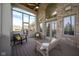 Screened-in patio featuring wood floors, brick accents, and a seating area for relaxation and entertaining at 4890 Benthaven E Dr, Bargersville, IN 46106