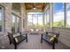 Screened-in patio featuring wood floors, wood ceiling, and comfortable seating perfect for enjoying outdoor living at 4890 Benthaven E Dr, Bargersville, IN 46106