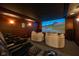 Home theater with luxurious reclining chairs, comfortable seating, and a unique starry ceiling at 4890 Benthaven E Dr, Bargersville, IN 46106