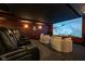 Home theater with black leather reclining seats, accent chairs, and a starry ceiling at 4890 Benthaven E Dr, Bargersville, IN 46106