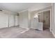 Large bedroom showcasing carpet flooring, decorative wallpaper, and adjacent bathroom at 5039 Five Points Rd, Indianapolis, IN 46239